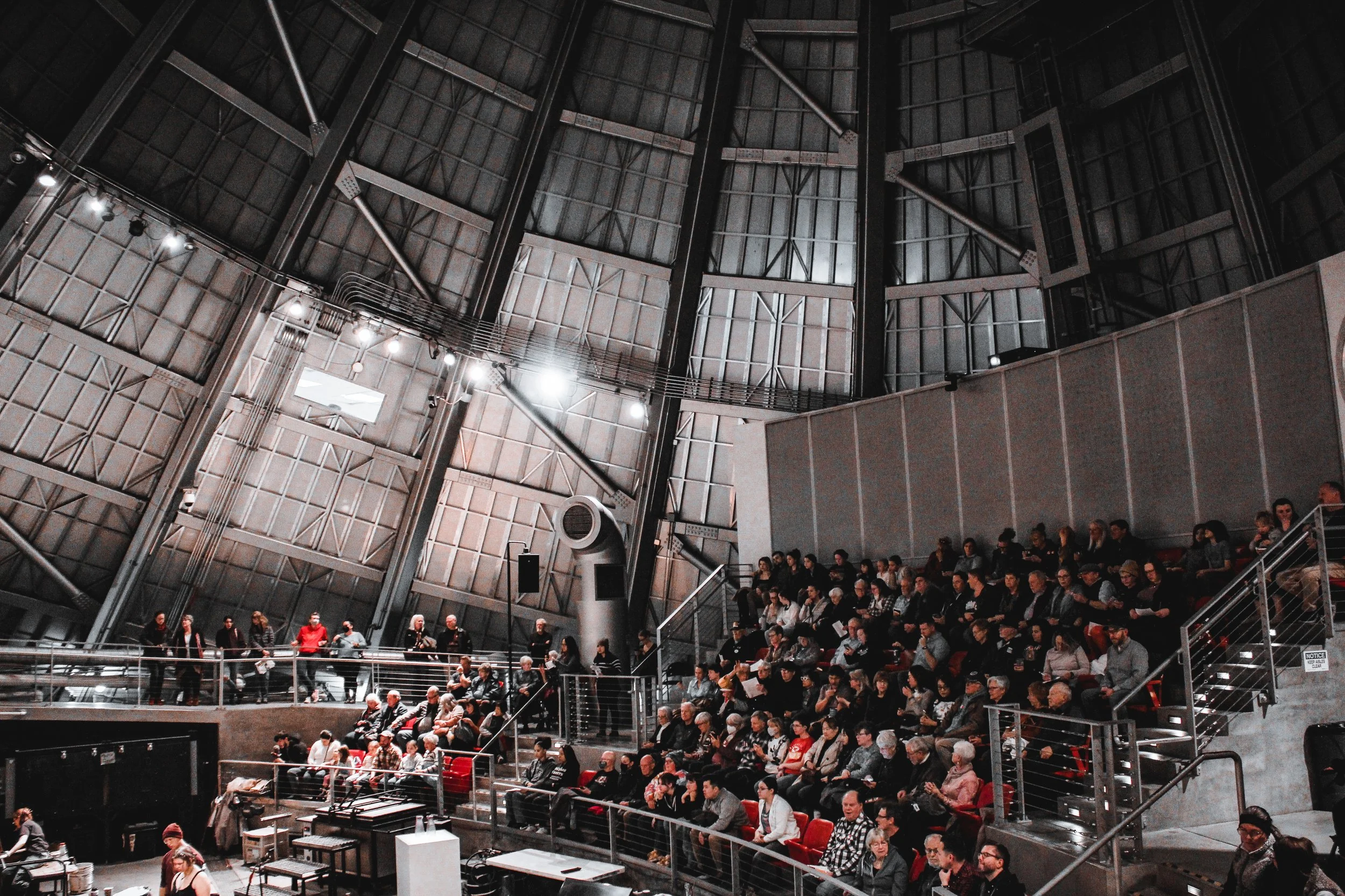 Visitors watching glassblowers in the Museum of Glass Hot Shop