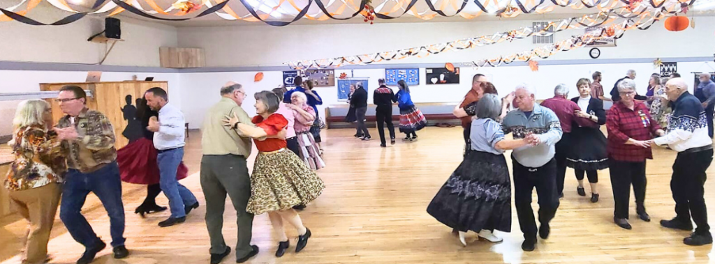 Couples square dancing at the Kitsap Square Dance Center